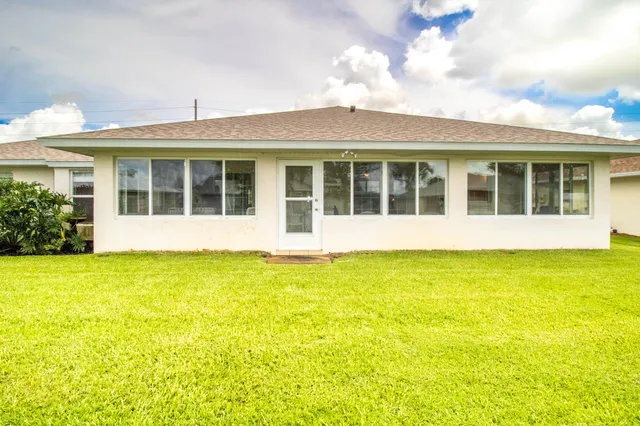 front view of a large building with a big yard