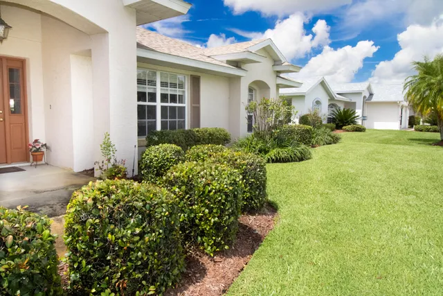 a view of a house with a garden