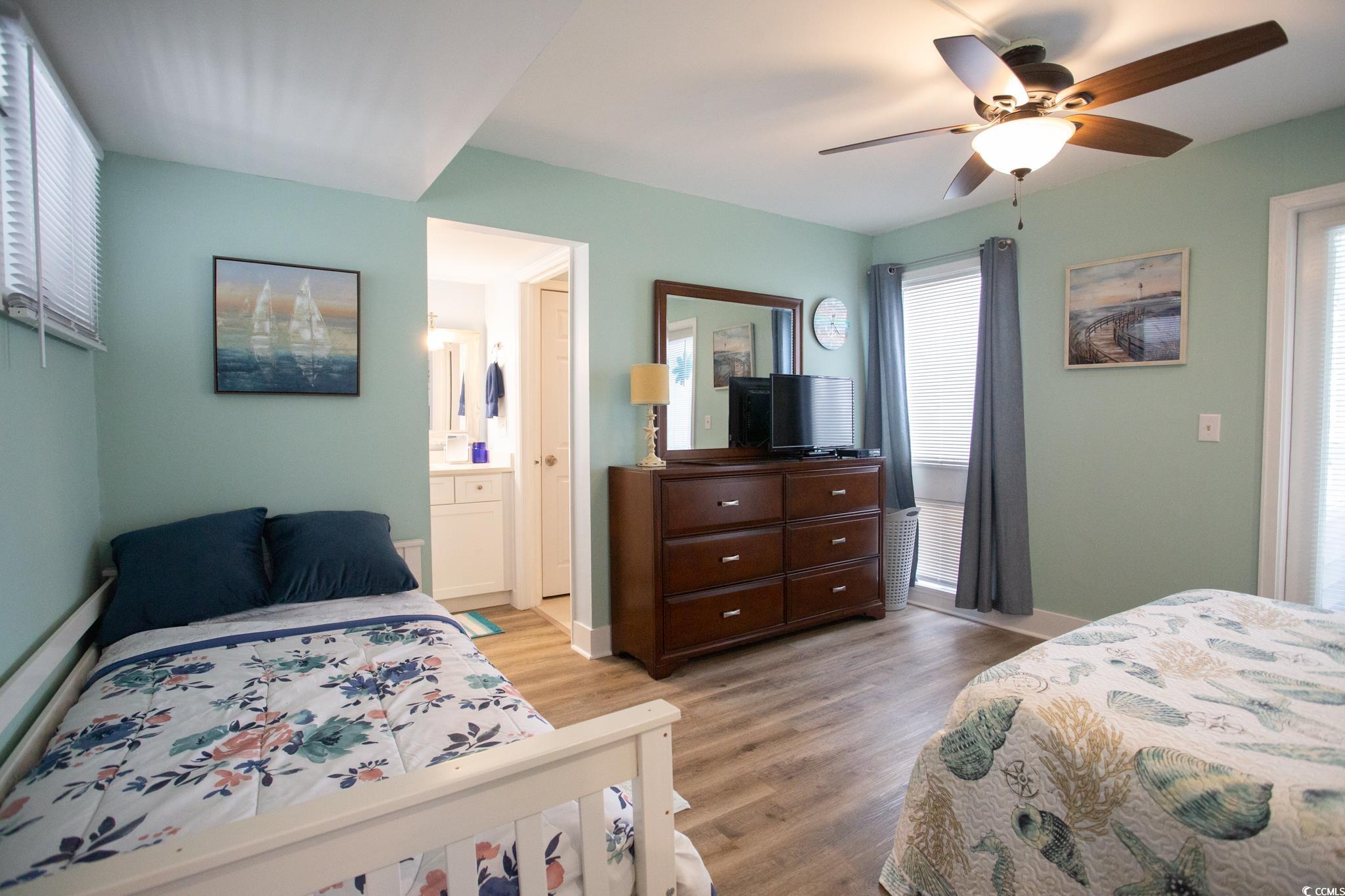 351 Lake Arrowhead Road, Unit 25404 Myrtle Beach, SC 29572 - Photo 11 of 37 Bedroom with light wood-type flooring, ceiling fan, and ensuite bathroom