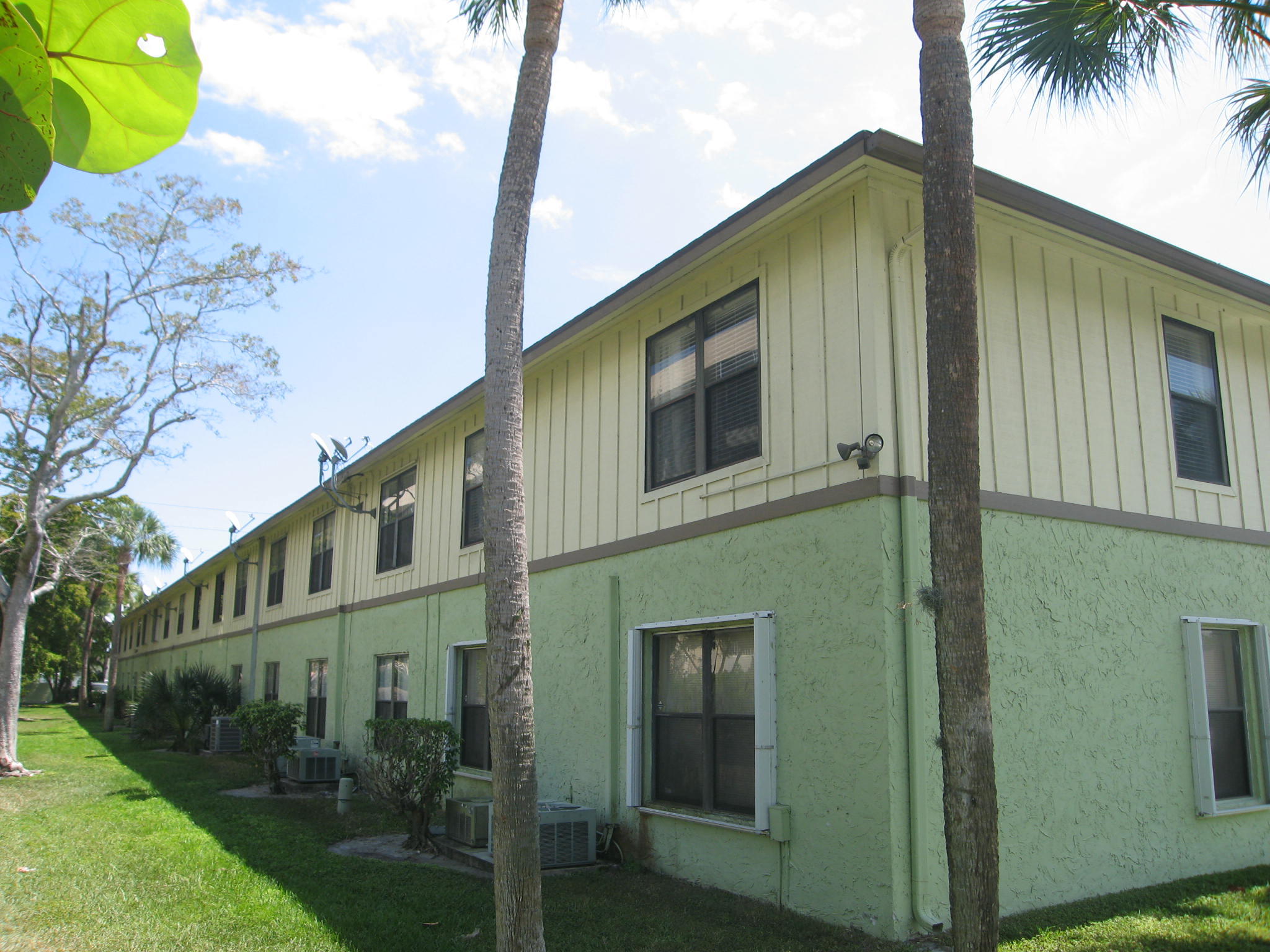 201 Southwest 1st Street, Unit 8 Boca Raton, FL 33432 - Photo 26 of 27 a front view of a house with a yard