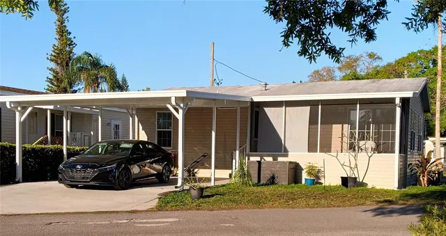 a view of a car parked in front of a house