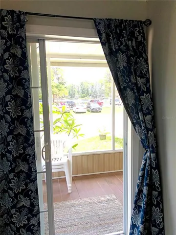 a view of a swimming pool with a table and chairs