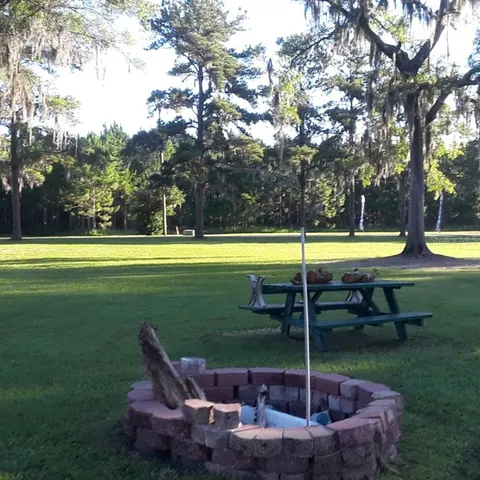 a view of a lake with a house in background