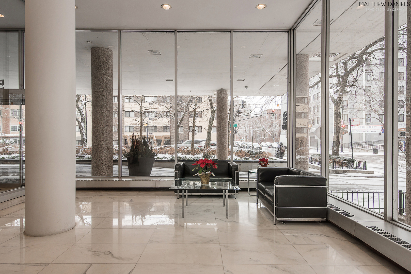 5757 North Sheridan Road, Unit 8C Chicago, IL 60660 - Photo 2 of 15 a lobby with furniture and floor to ceiling window