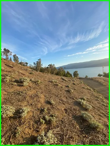 a view of a large body of water with a building in the background