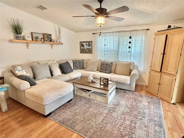 a living room with furniture and a rug