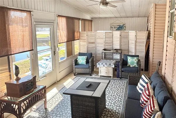 a living room with furniture and a window