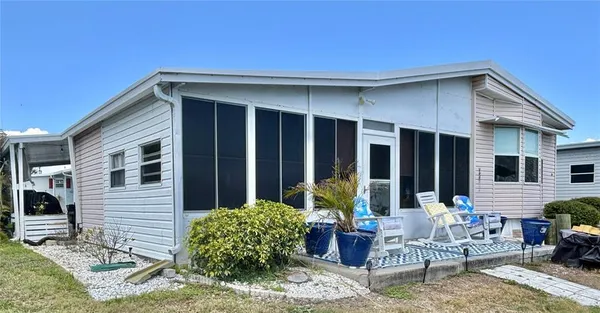 a backyard of a house with seating space