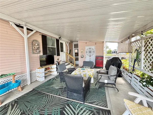 a living room with furniture and a rug