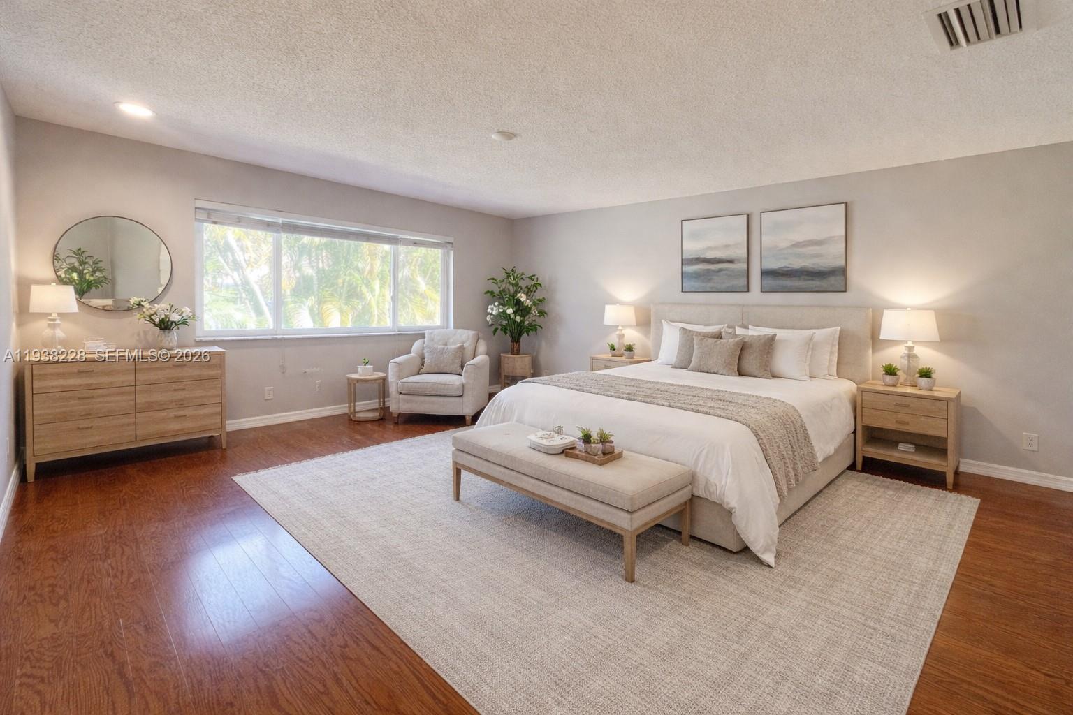 15827 Southwest 12th Street Pembroke Pines, FL 33027 - Photo 11 of 24 a bedroom with a bed and a window