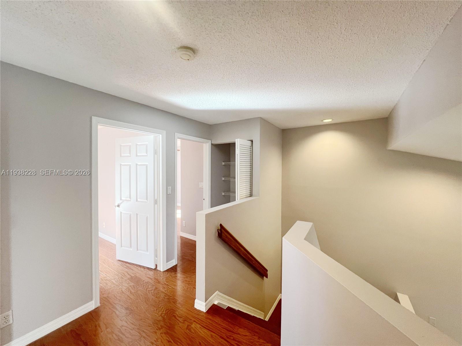 15827 Southwest 12th Street Pembroke Pines, FL 33027 - Photo 15 of 24 a view of an empty room with wooden floor and a window