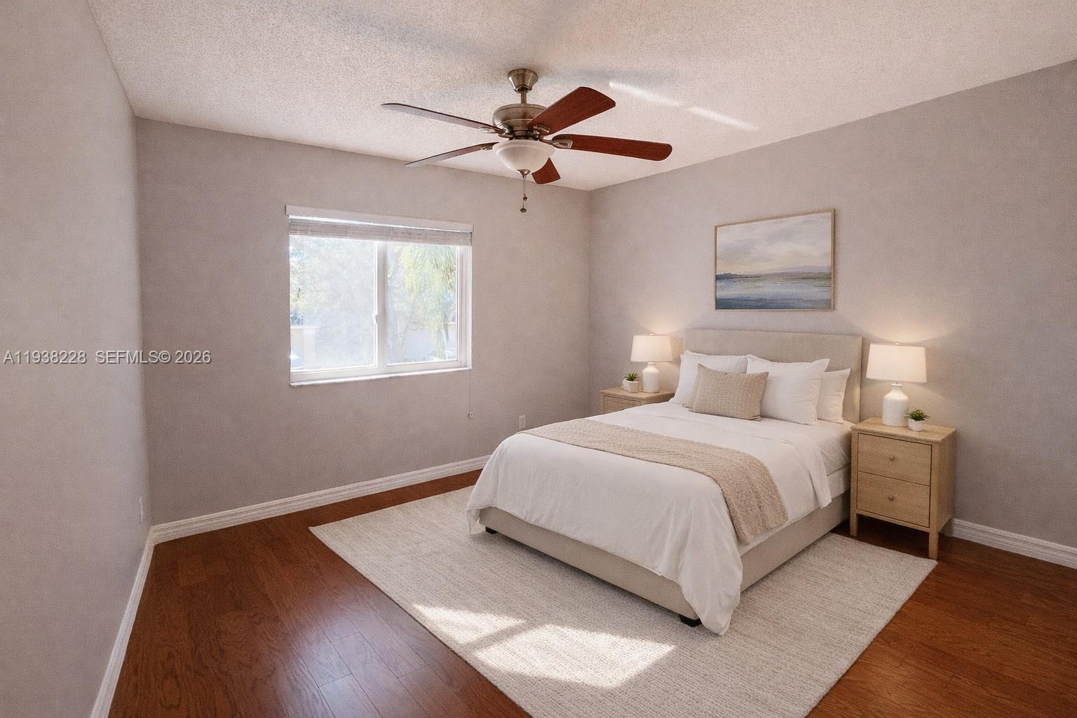 15827 Southwest 12th Street Pembroke Pines, FL 33027 - Photo 16 of 24 a bedroom with bed and window