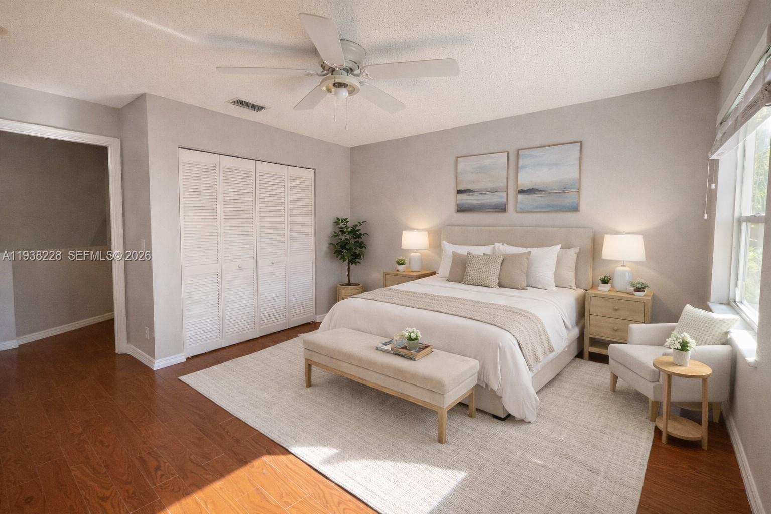 15827 Southwest 12th Street Pembroke Pines, FL 33027 - Photo 18 of 24 a bedroom with a bed and wooden floor