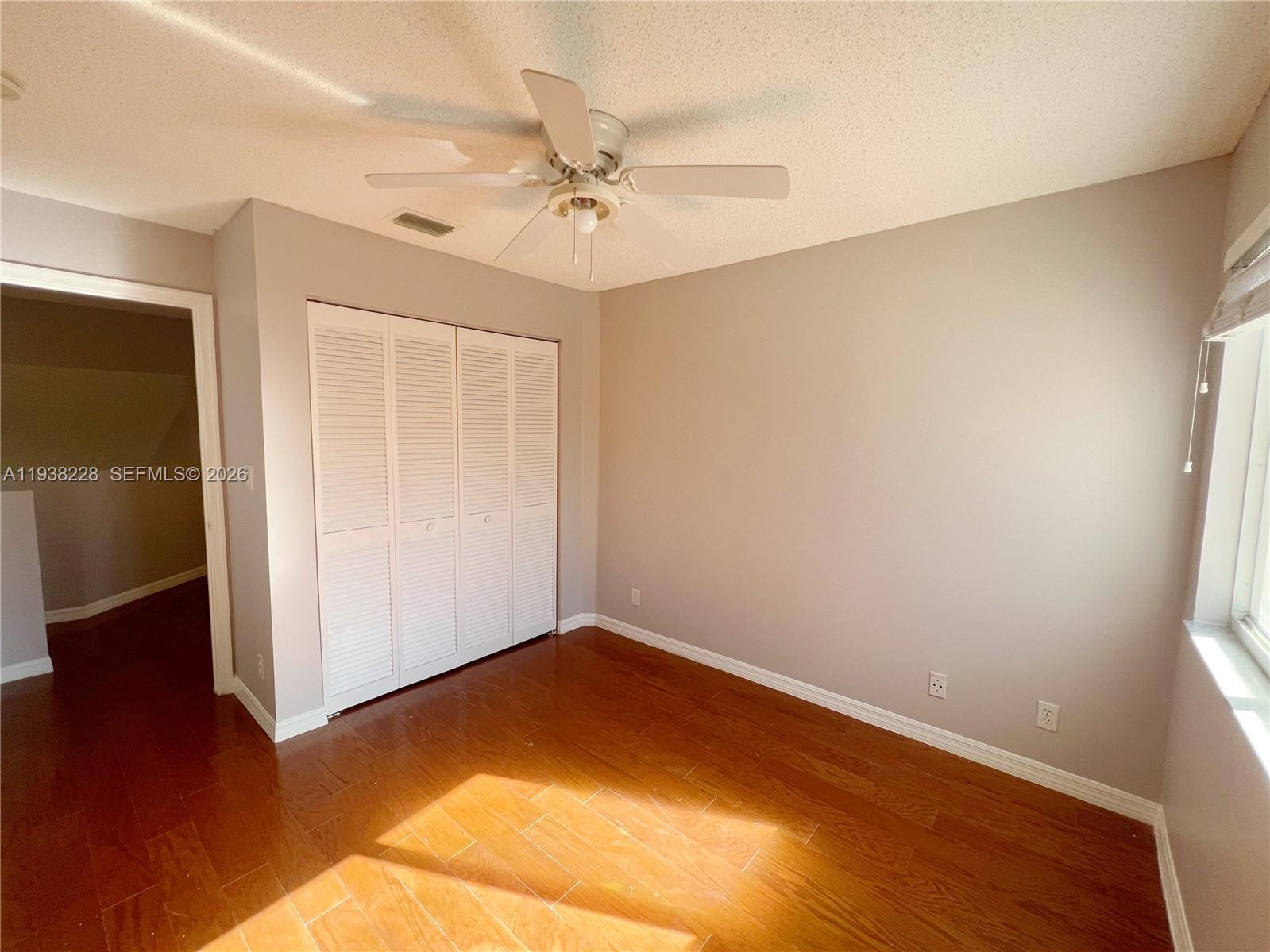 15827 Southwest 12th Street Pembroke Pines, FL 33027 - Photo 19 of 24 wooden floor in an empty room
