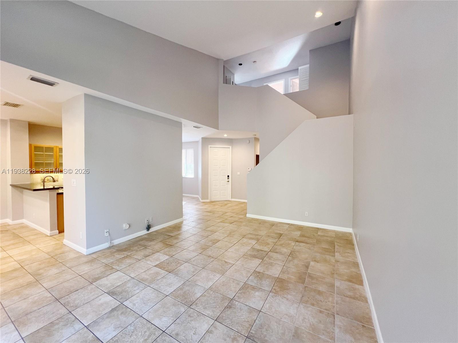 15827 Southwest 12th Street Pembroke Pines, FL 33027 - Photo 5 of 24 a view of a big room with closet and windows