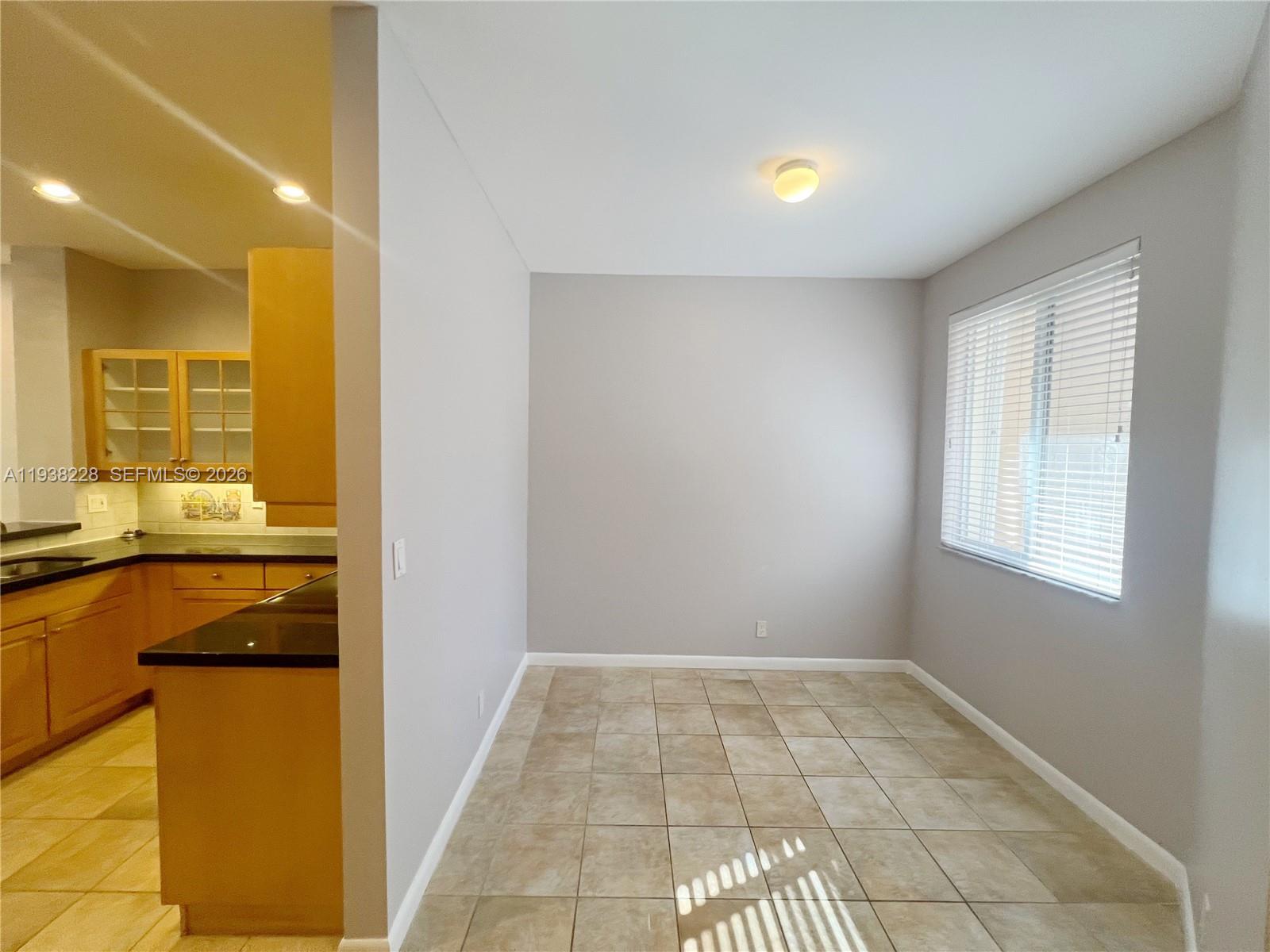 15827 Southwest 12th Street Pembroke Pines, FL 33027 - Photo 10 of 24 a view of livingroom with kitchen
