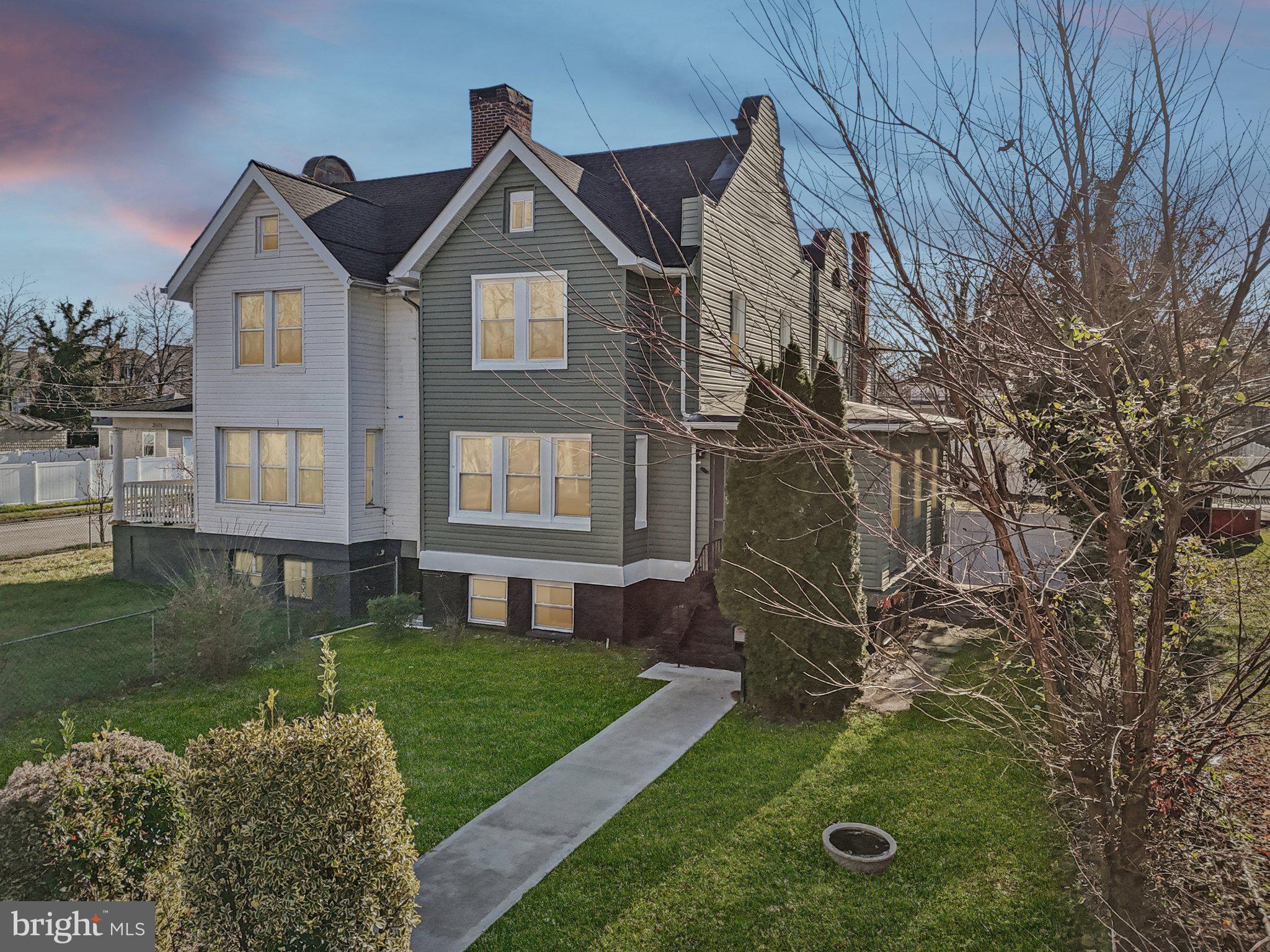 3603 Springdale Avenue Baltimore, MD 21216 - Photo 1 of 63 a front view of a house with garden