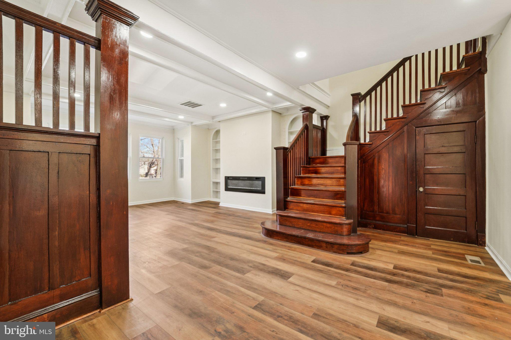 3603 Springdale Avenue Baltimore, MD 21216 - Photo 11 of 63 a view of entryway with wooden floor and stairs