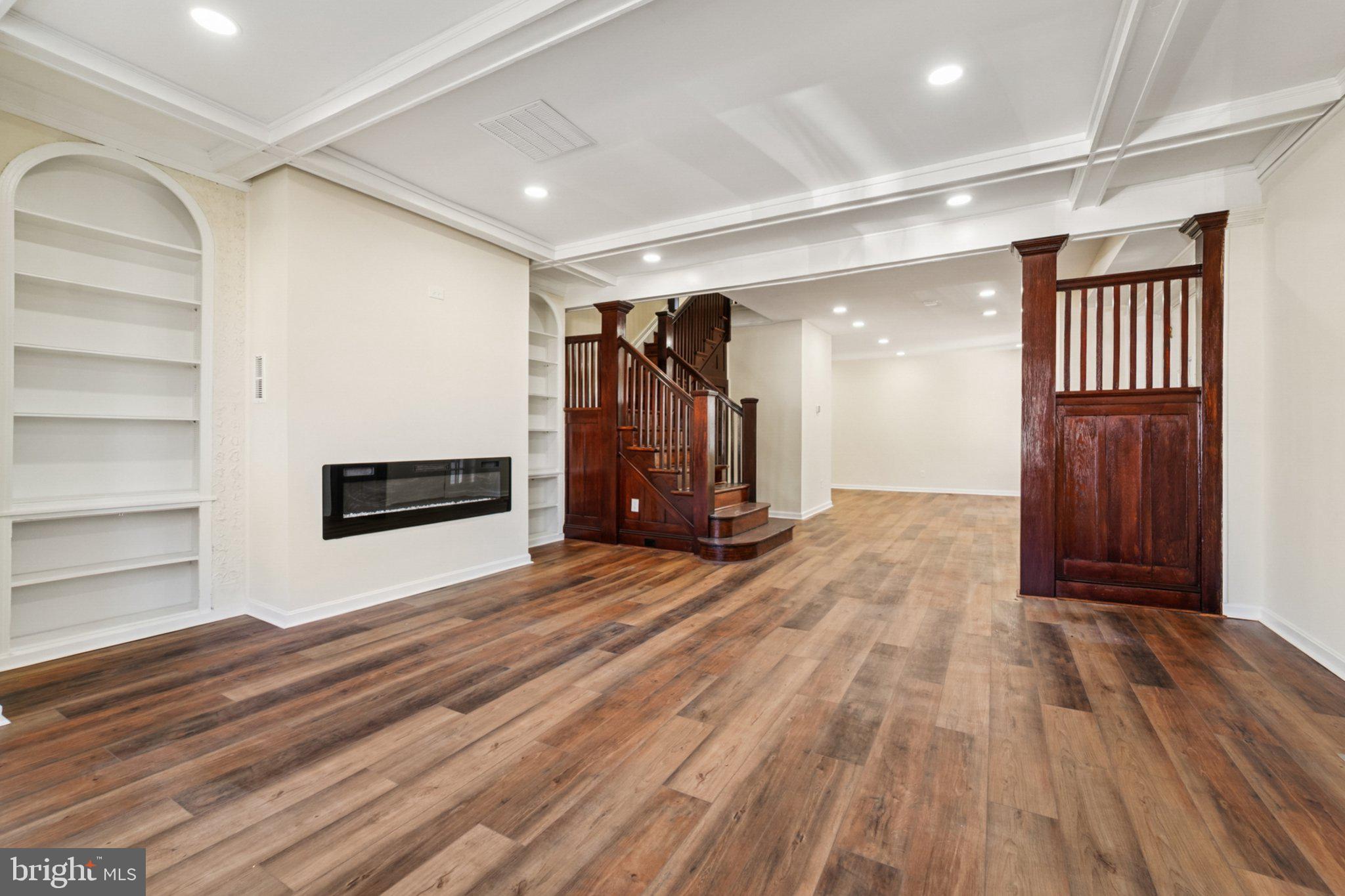3603 Springdale Avenue Baltimore, MD 21216 - Photo 14 of 63 a view of an empty room with wooden floor and entryway
