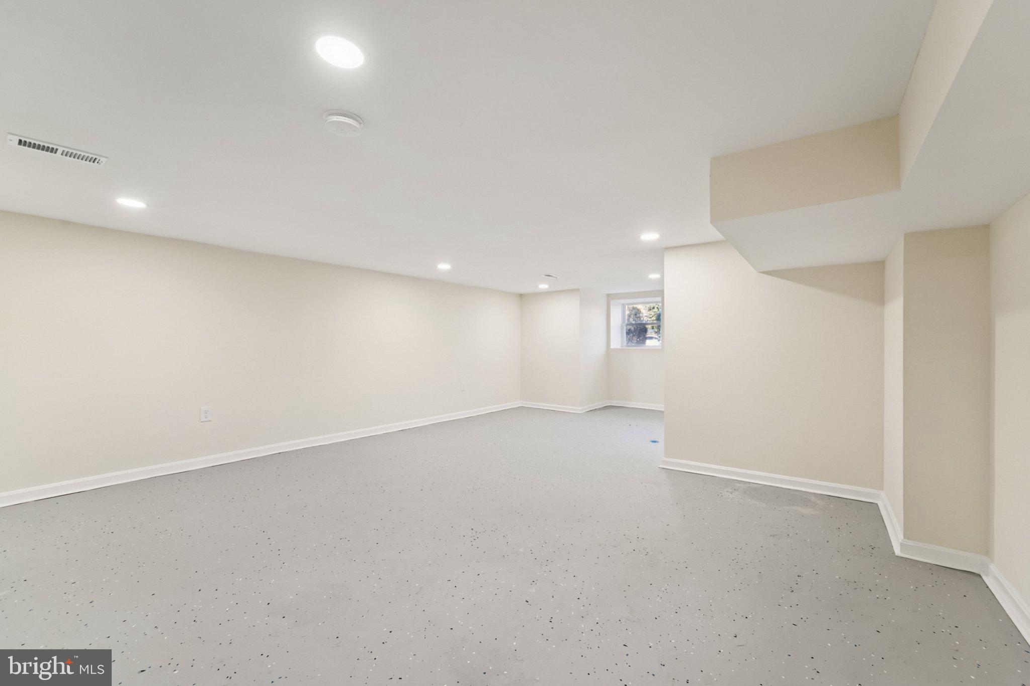 3603 Springdale Avenue Baltimore, MD 21216 - Photo 23 of 63 an empty room with a empty space and windows