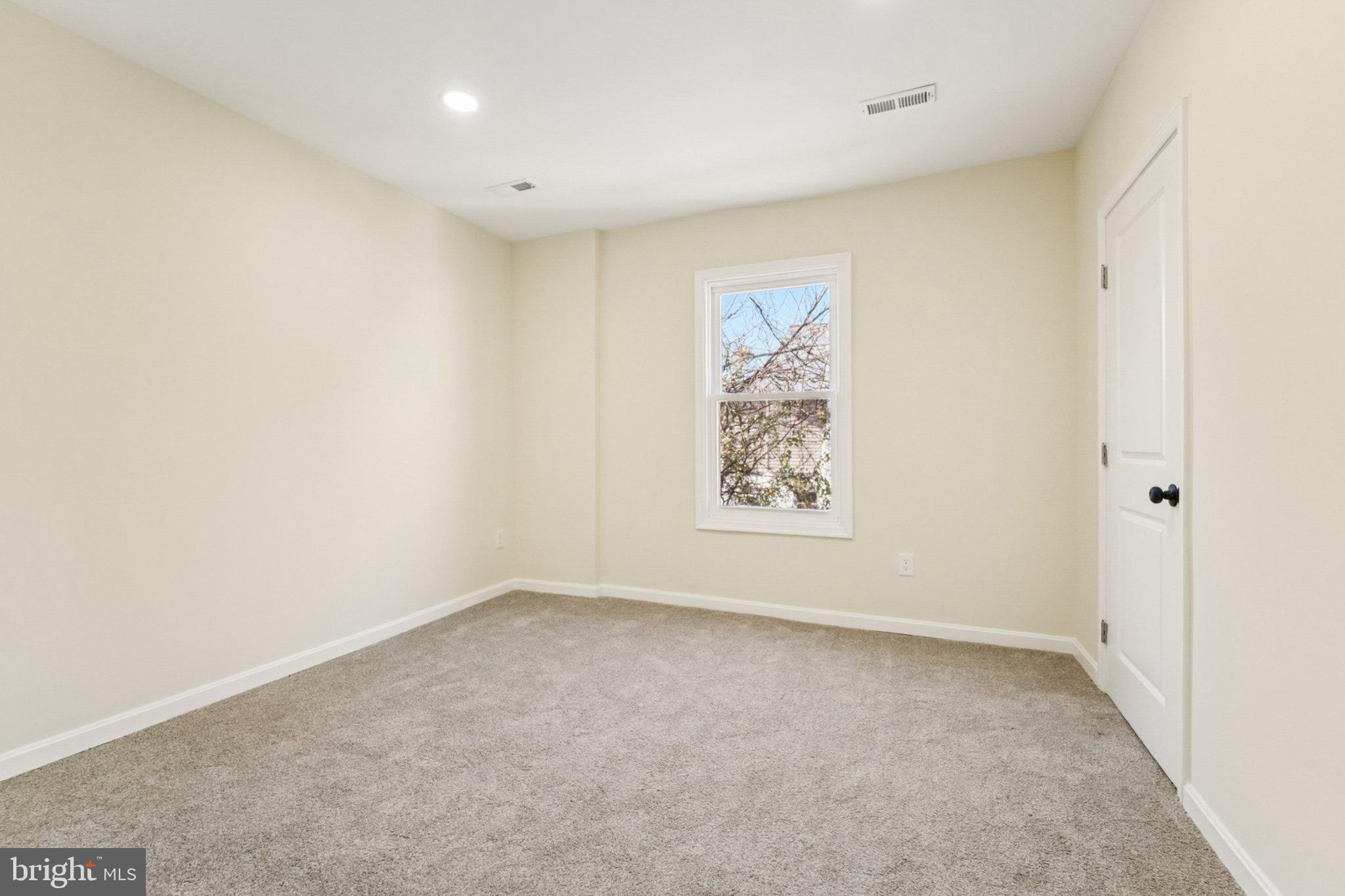 3603 Springdale Avenue Baltimore, MD 21216 - Photo 31 of 63 an empty room with a window