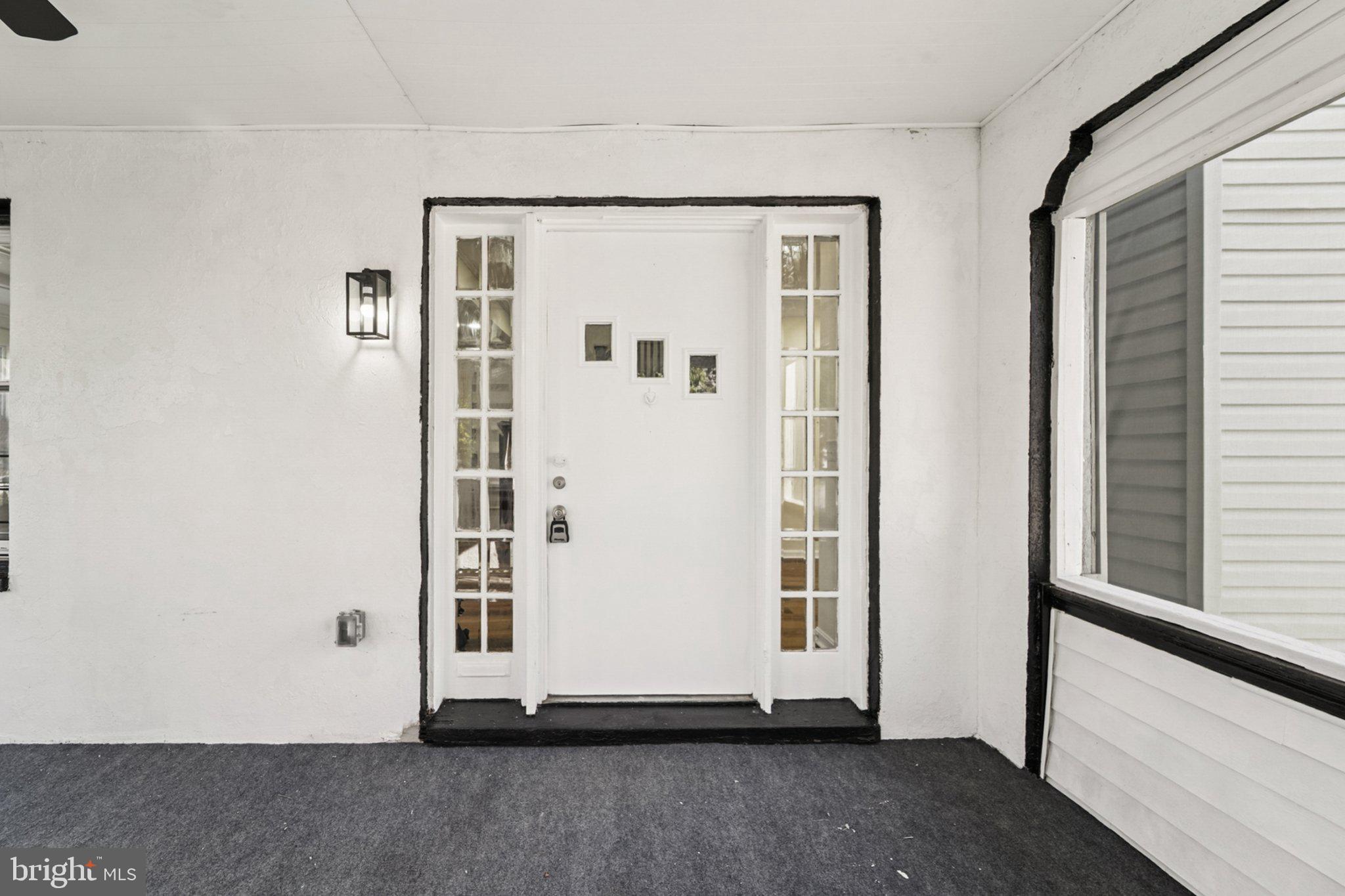 3603 Springdale Avenue Baltimore, MD 21216 - Photo 40 of 63 a view of a small space with wooden floor and a window