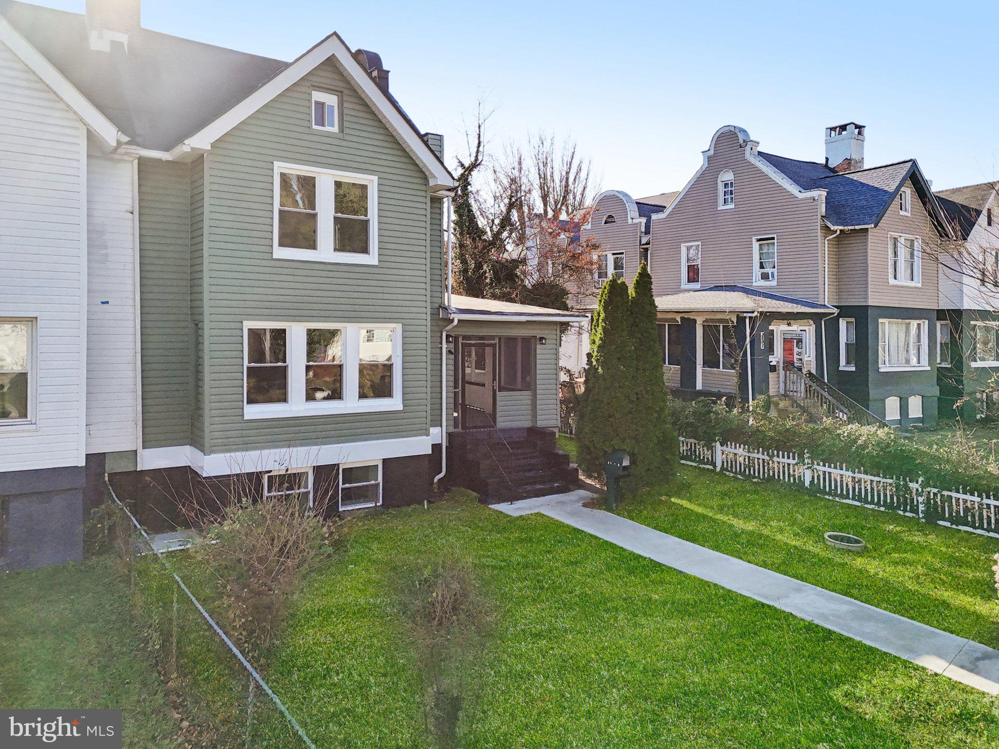 3603 Springdale Avenue Baltimore, MD 21216 - Photo 4 of 63 a front view of a house with a yard