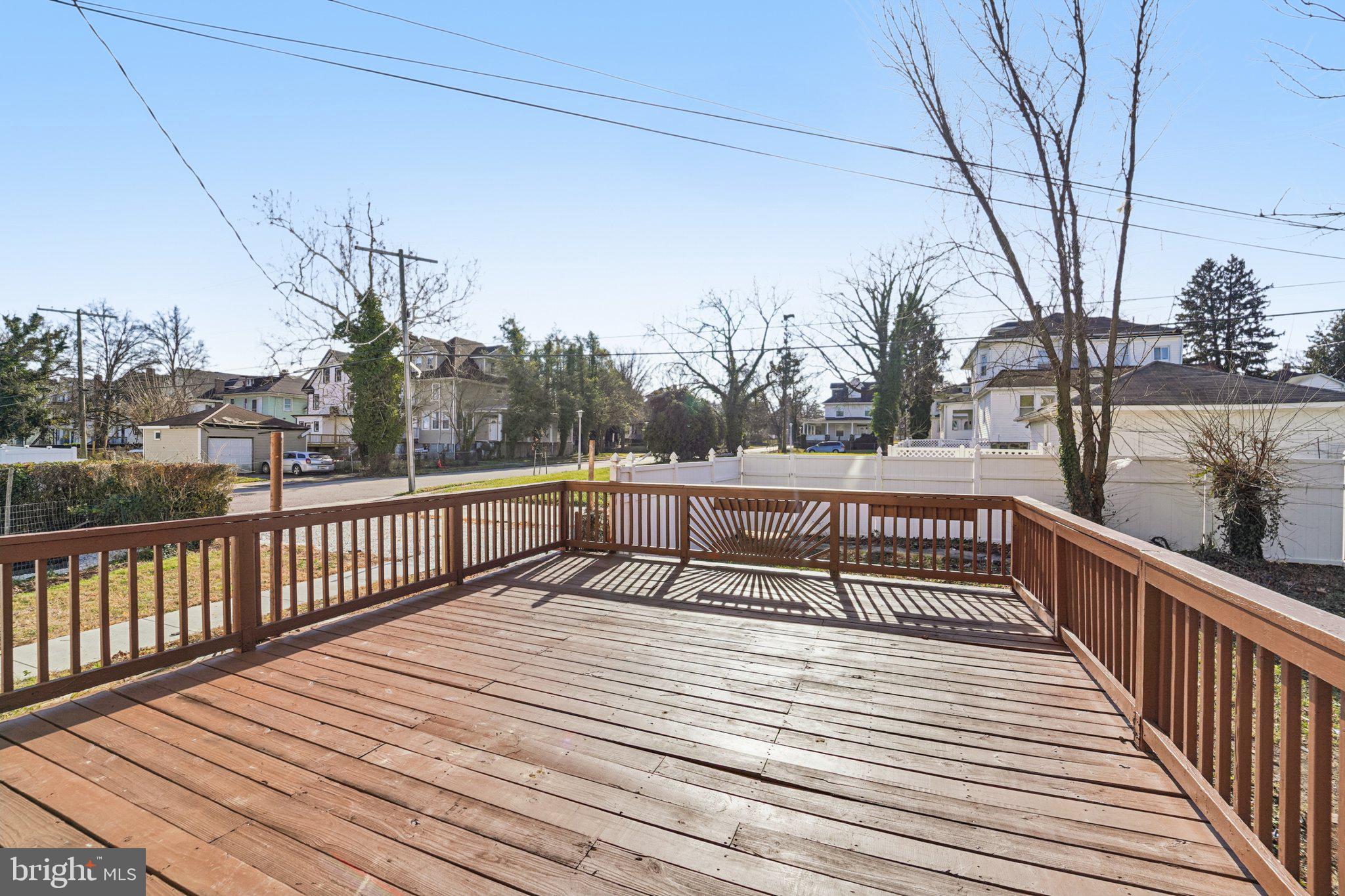 3603 Springdale Avenue Baltimore, MD 21216 - Photo 42 of 63 a view of balcony with wooden floor and fence