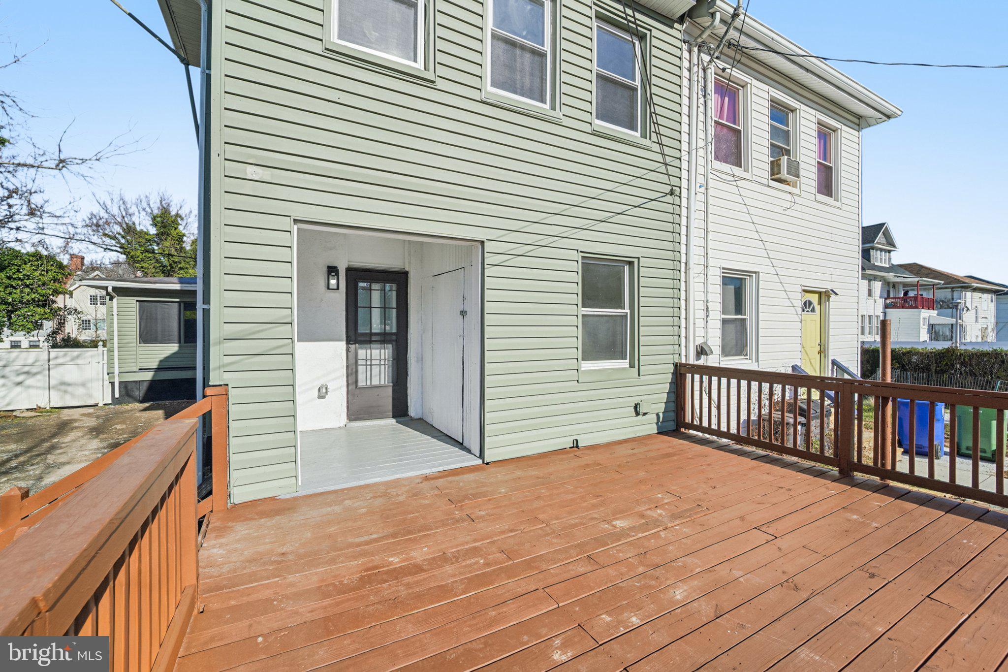 3603 Springdale Avenue Baltimore, MD 21216 - Photo 44 of 63 a view of a house with a balcony and wooden floor