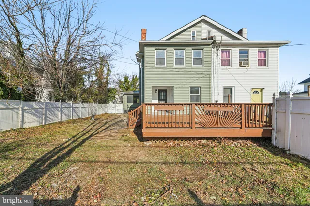 a front view of a house with a yard table and chairs