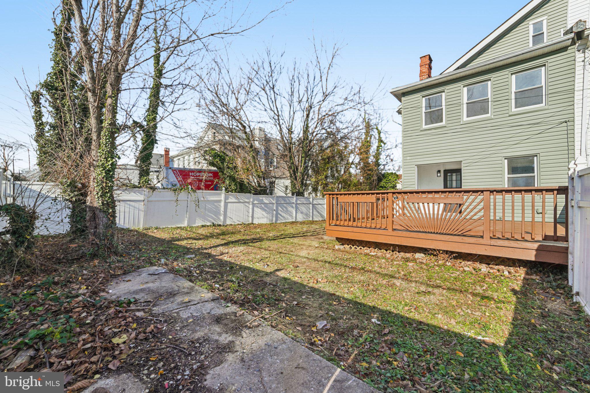3603 Springdale Avenue Baltimore, MD 21216 - Photo 46 of 63 a view of a house with backyard and trees