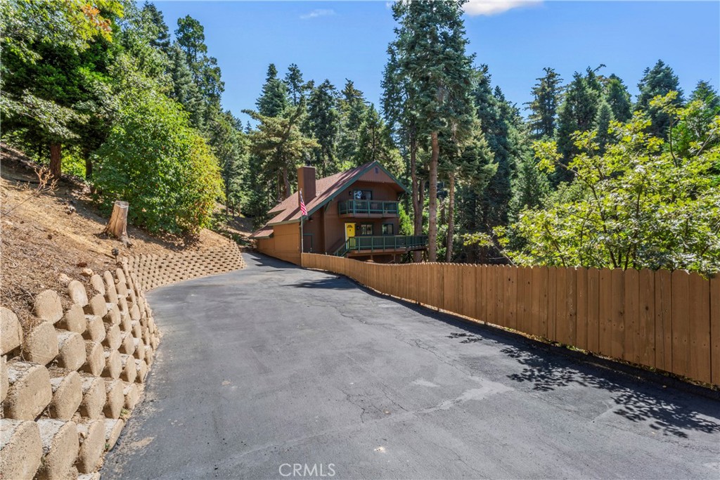 899 Blue Ridge Drive Lake Arrowhead, CA 92385 - Photo 42 of 49 a view of a house with a yard