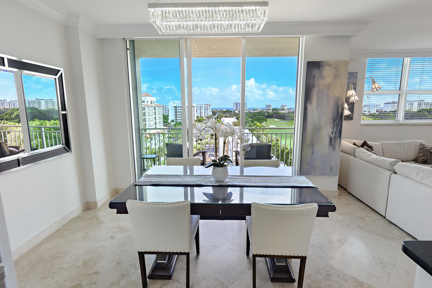99 Southeast Mizner Boulevard, Unit PH 909 Boca Raton, FL 33432 - Photo 1 of 51 a view of a dining room with furniture window and outside view