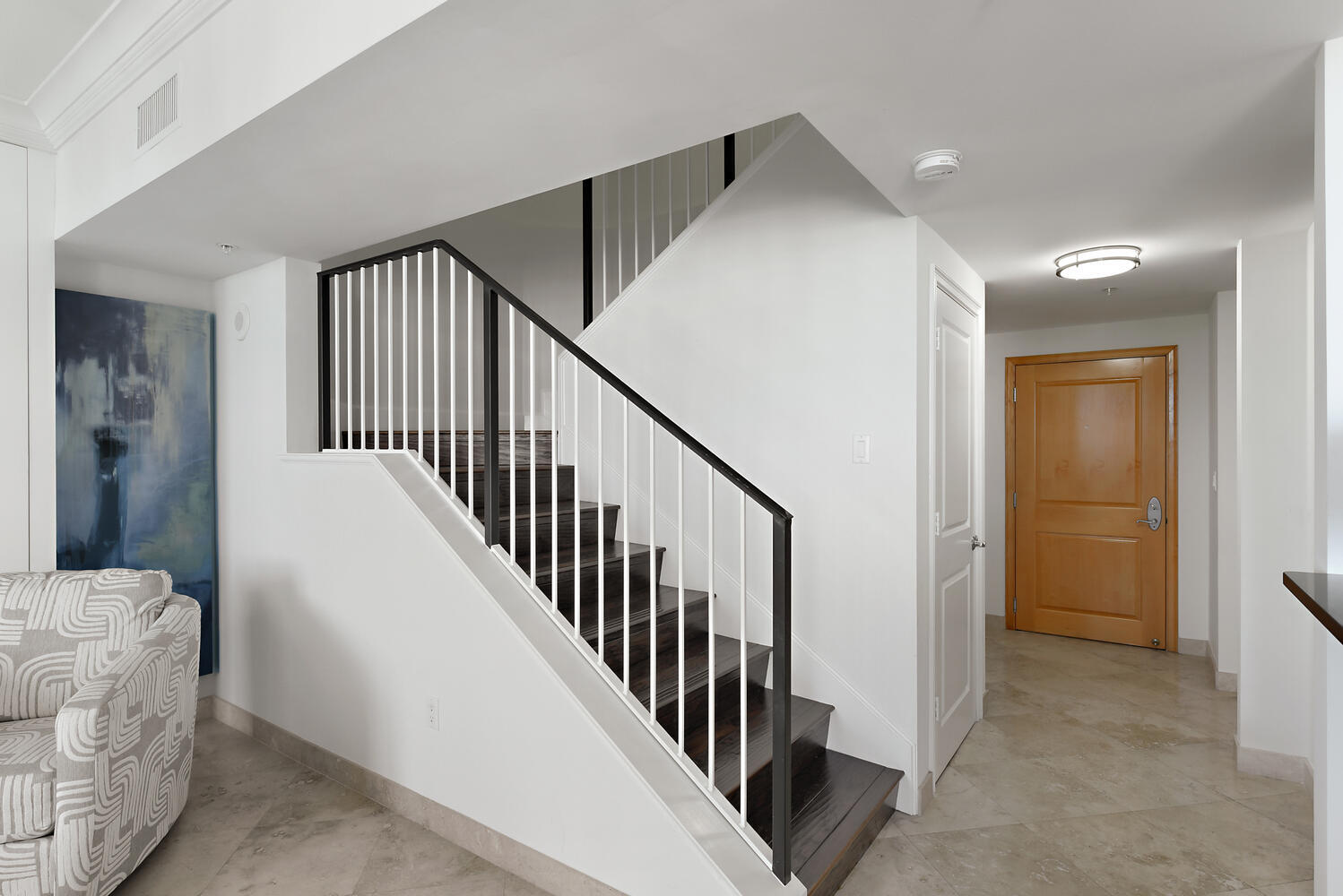 99 Southeast Mizner Boulevard, Unit PH 909 Boca Raton, FL 33432 - Photo 12 of 51 a view of a hallway with windows and stairs