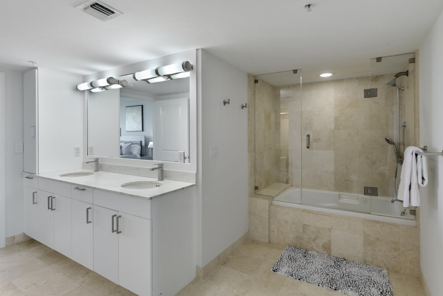 99 Southeast Mizner Boulevard, Unit PH 909 Boca Raton, FL 33432 - Photo 18 of 51 a bathroom with a sink a toilet and shower
