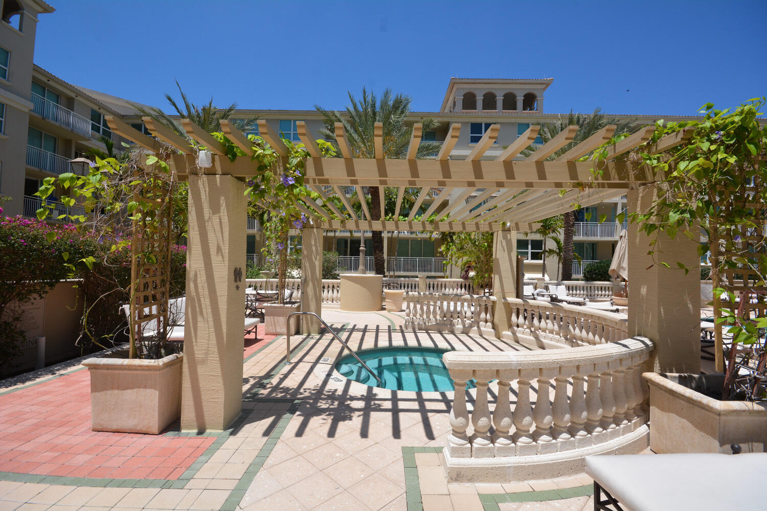 99 Southeast Mizner Boulevard, Unit PH 909 Boca Raton, FL 33432 - Photo 25 of 51 a view of a patio with couches table and chairs and potted plants