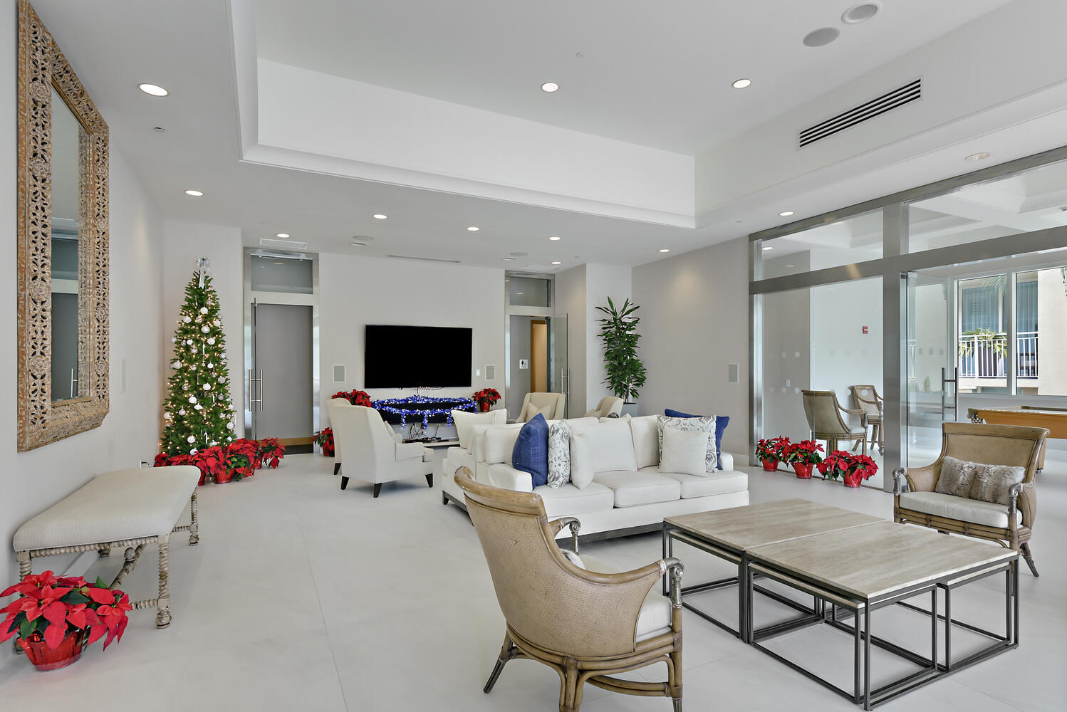 99 Southeast Mizner Boulevard, Unit PH 909 Boca Raton, FL 33432 - Photo 27 of 51 a living room with furniture and a flat screen tv