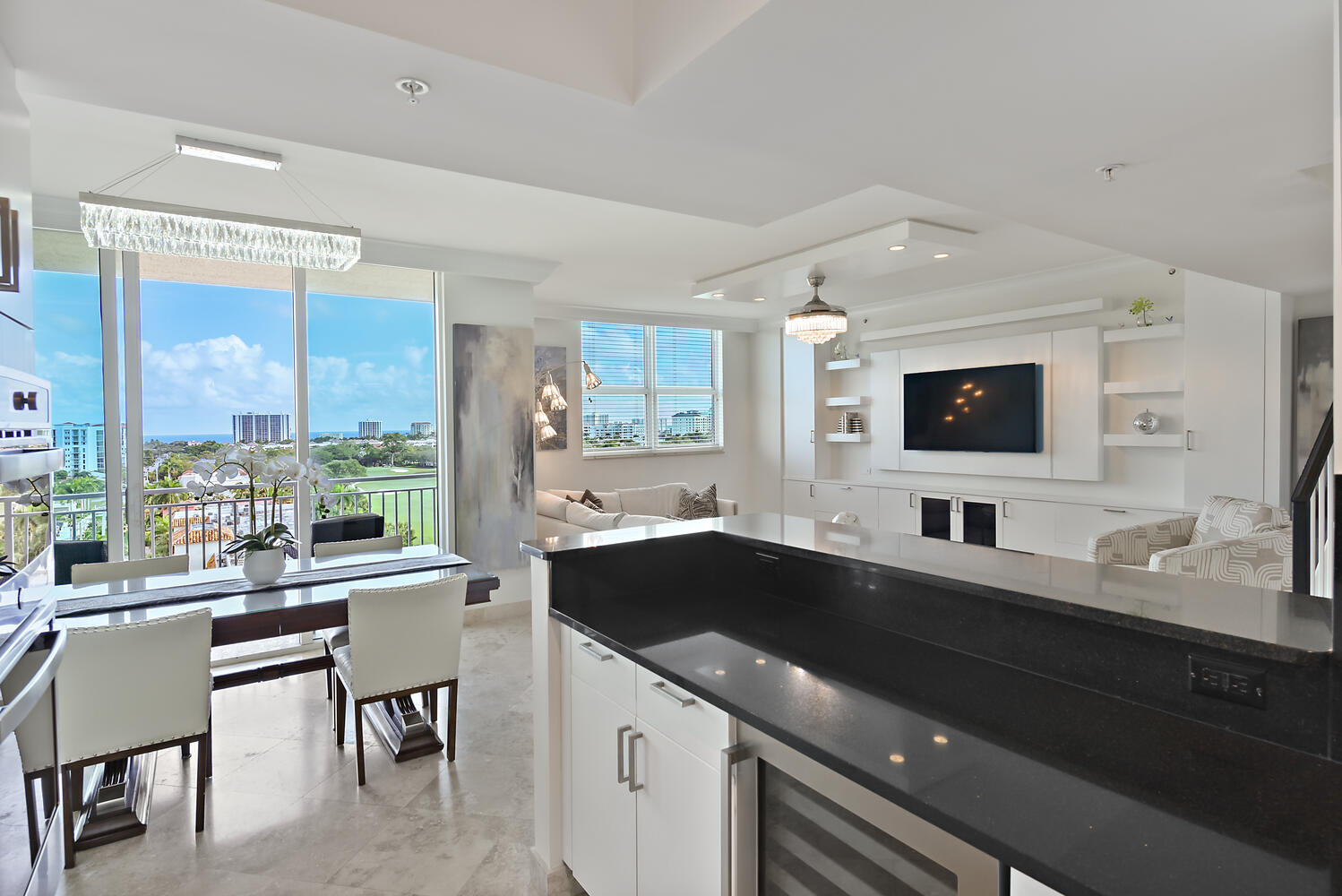 99 Southeast Mizner Boulevard, Unit PH 909 Boca Raton, FL 33432 - Photo 7 of 51 a large kitchen with granite countertop a sink and cabinets
