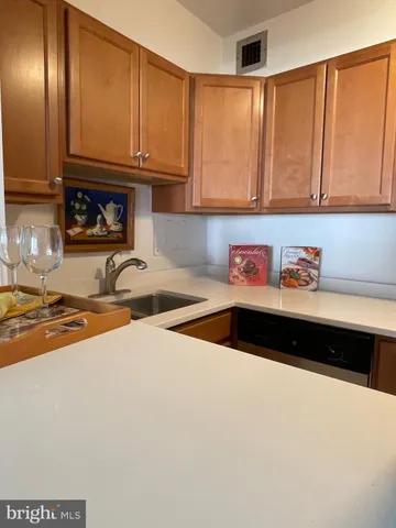 a kitchen with a sink and cabinets