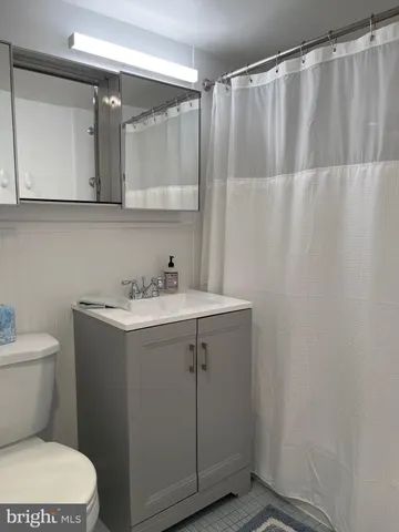 a view of building with car parked