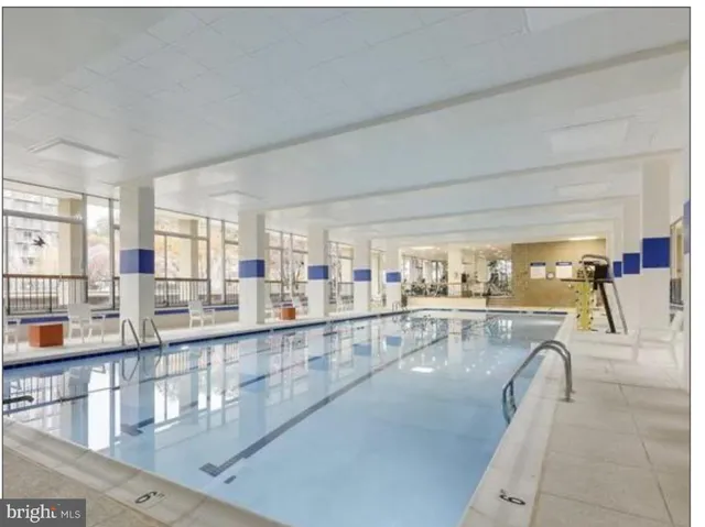a view of a room with gym equipment and a large window