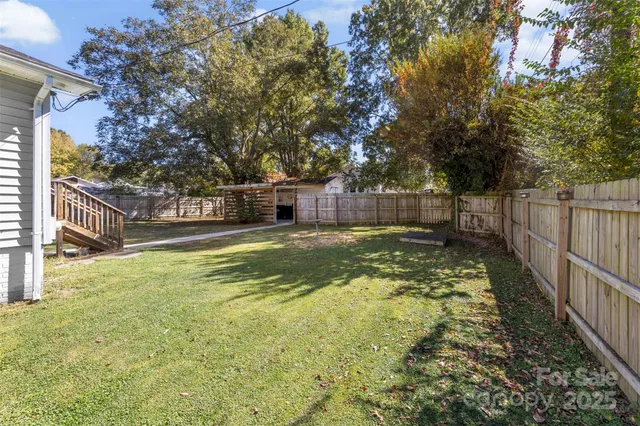 a view of swimming pool with trees in the background