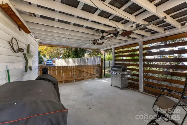 a front view of a house with wooden fence