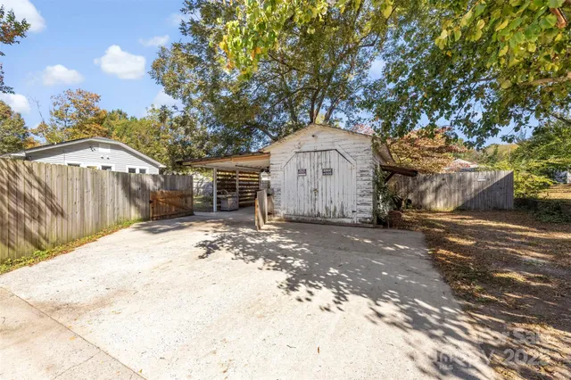a brick house with a tree in front of it