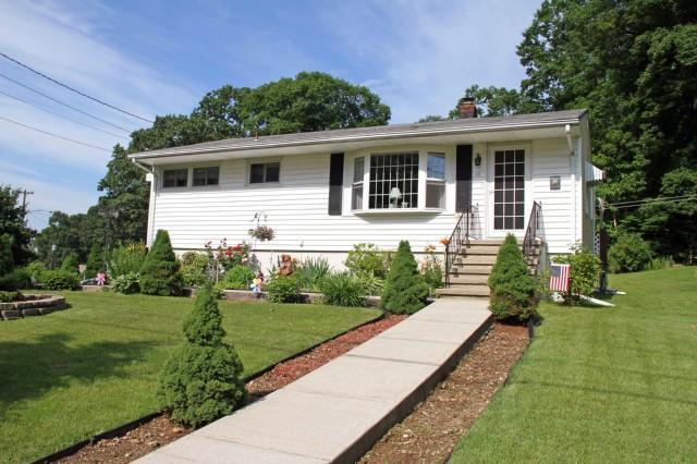 a front view of a house with a yard