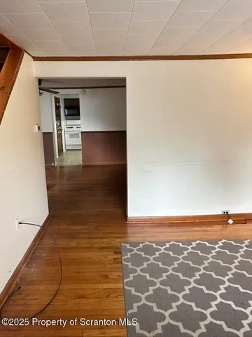 a view of hallway with seating area