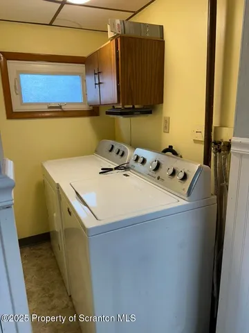 a utility room with washer and dryer