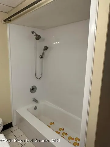 a bathroom with a bath tub