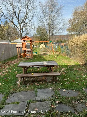 a view of a park with large trees