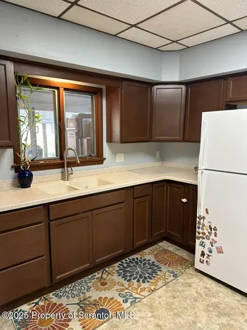 a bathroom with a sink and a large mirror